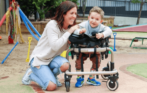 Woman and child smiling at the park