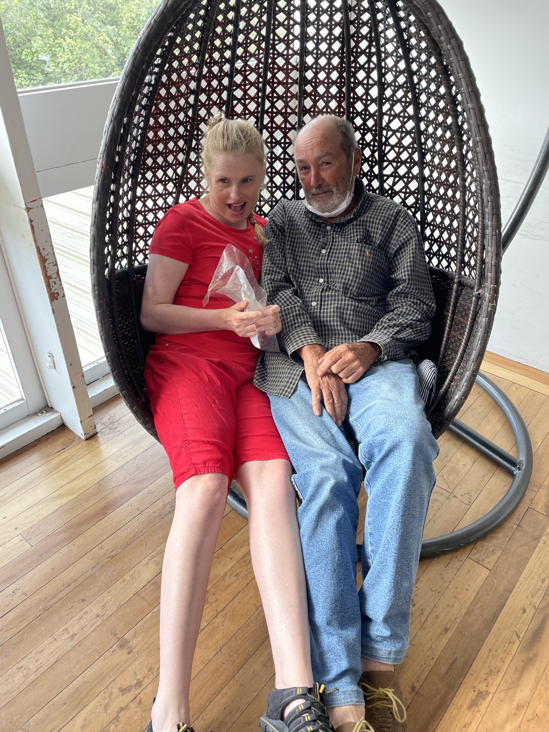 Sarah and Dad in her favourite Egg Swing chair (HUB 2022 Christmas Party)