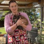 Katrina at Garden House cuddling a rabbit