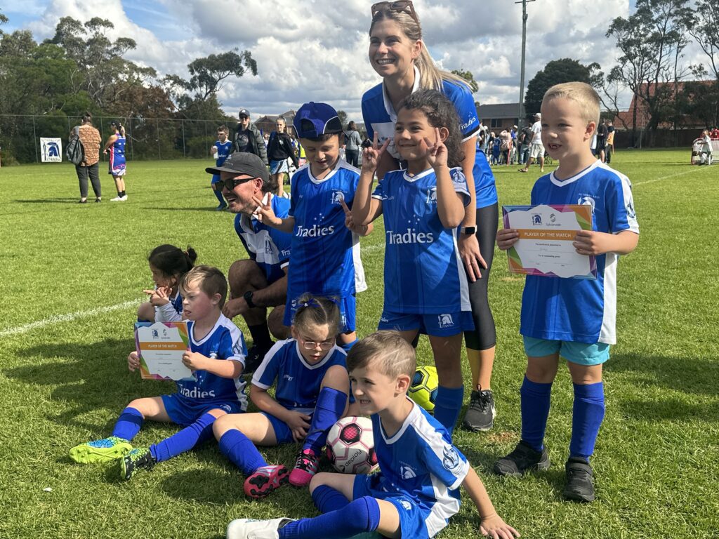 Sutherland Titans Football Club players posing together after game