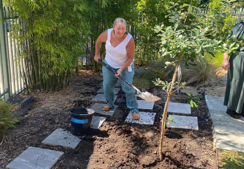 Sylvanvale 75th Year Update Sylvanvale CEO planting a tree at Garden House