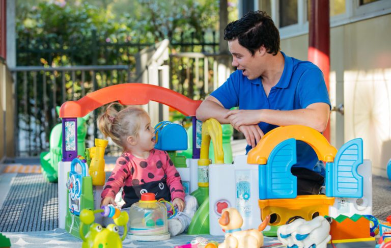 Mikarie childcare worker with child