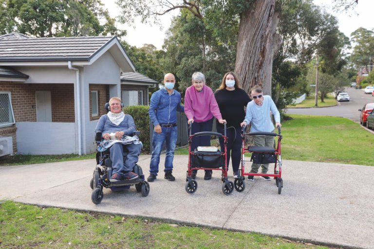 Support staff and residents outside