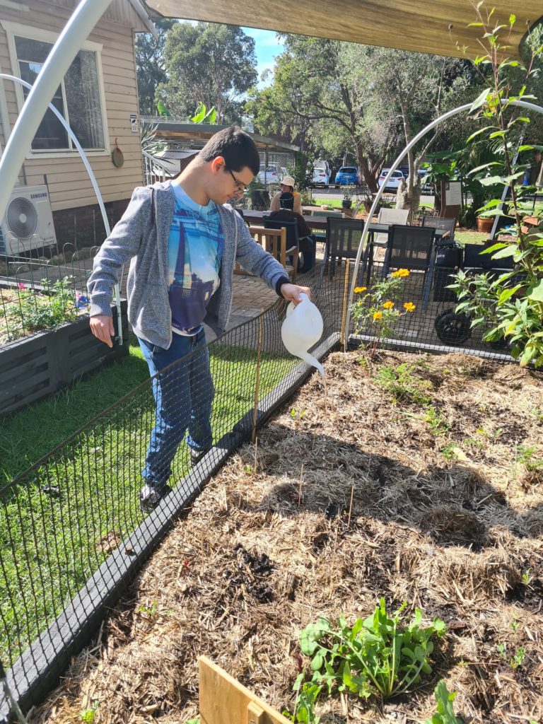 Participant watering garden